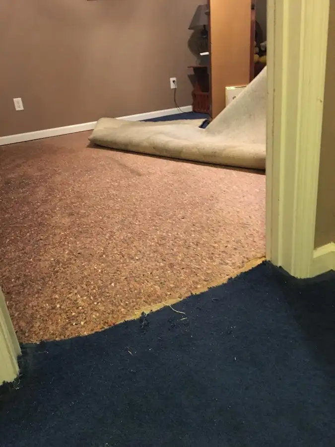 Carpet pad removal revealing water damage during Drying & Dehumidification in Skiatook